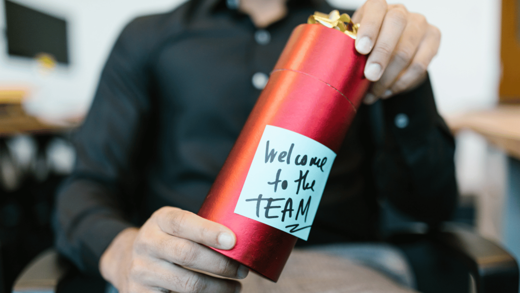 Remote employee receiving a welcome package from the virtual team as part of the remote onboarding process