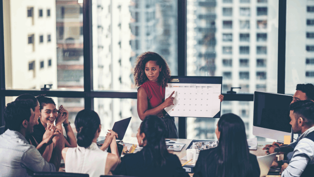 Team leader discussing how to handle customer interactions effectively and efficiently to a group of support agents.