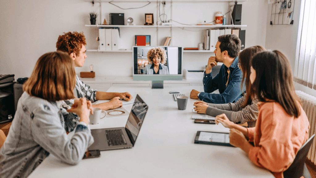 Hiring managers discussing amongst themselves in a hybrid or remote setting.