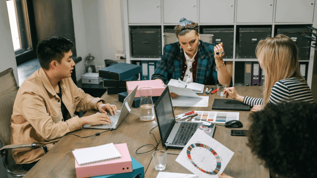 Customer service team discussing AI + human workflows